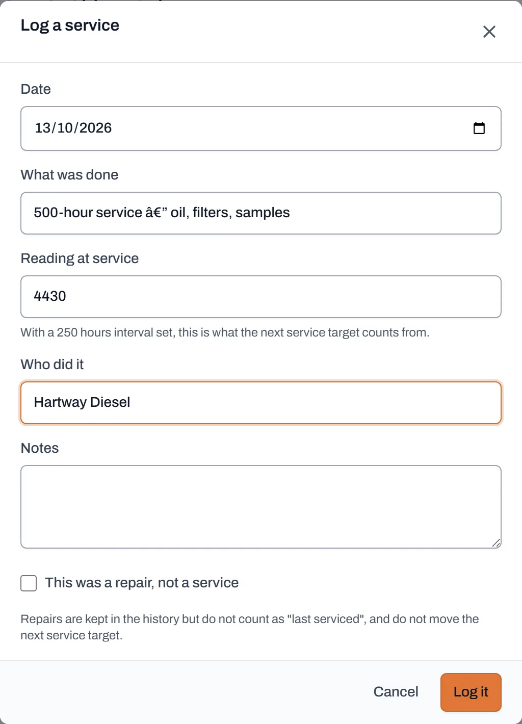 The Log a service dialog filled in with a description, the meter reading at service and the provider