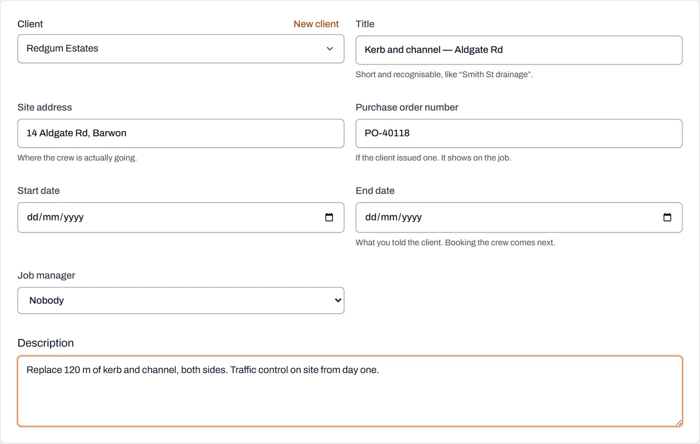 The New job form filled in with a title, a client, a site address and a description, ready to create